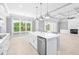 Island kitchen with white cabinets and stainless steel appliances at 1847 Woodstork Dr., Conway, SC 29526