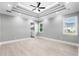 Bright bedroom with ceiling fan, recessed lighting, and light grey walls at 1847 Woodstork Dr., Conway, SC 29526