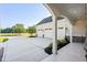 Three-car garage with white doors and stone accents at 1847 Woodstork Dr., Conway, SC 29526