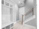 Bright entry with built-in bench, shelving and staircase at 1847 Woodstork Dr., Conway, SC 29526
