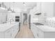 White kitchen with stainless steel appliances and quartz countertops at 1847 Woodstork Dr., Conway, SC 29526