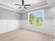 Spacious home office featuring wainscoting, large window, and hardwood floors at 1847 Woodstork Dr., Conway, SC 29526