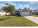 House exterior with a green facade and a lawn at 357 Cardita Loop, Myrtle Beach, SC 29588