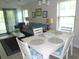 Dining area with white table and four chairs at 562 Blue Stem Dr. # 54R, Pawleys Island, SC 29585
