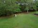 Spacious backyard with grill and lush green grass at 562 Blue Stem Dr. # 54R, Pawleys Island, SC 29585