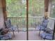 Screened balcony with wooded views and comfortable seating at 562 Blue Stem Dr. # 54R, Pawleys Island, SC 29585