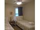 Bedroom with twin beds, nightstand, and world map bedding at 562 Blue Stem Dr. # 54R, Pawleys Island, SC 29585