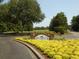 Golf course entrance with landscaping and signage at 562 Blue Stem Dr. # 54R, Pawleys Island, SC 29585