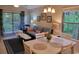 Living room with light blue sofa and dining area at 562 Blue Stem Dr. # 54R, Pawleys Island, SC 29585