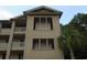 Tan building exterior with balconies and palm trees at 562 Blue Stem Dr. # 54R, Pawleys Island, SC 29585