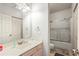 Well-lit bathroom with a shower, vanity, and mirror at 1301 Sweetwater Blvd. # 1301, Murrells Inlet, SC 29576