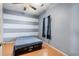 Cozy bedroom with a full-size bed and unique wall design at 1301 Sweetwater Blvd. # 1301, Murrells Inlet, SC 29576