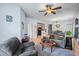 Spacious living room featuring a comfortable couch and a dining area at 1301 Sweetwater Blvd. # 1301, Murrells Inlet, SC 29576