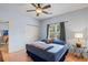Bright bedroom with a double bed, ceiling fan, and ample closet space at 1301 Sweetwater Blvd. # 1301, Murrells Inlet, SC 29576