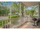 Screened porch with outdoor grill and view of community at 1301 Sweetwater Blvd. # 1301, Murrells Inlet, SC 29576