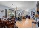 Open dining area with table and chairs, adjacent to living room at 1301 Sweetwater Blvd. # 1301, Murrells Inlet, SC 29576