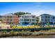 Aerial view of three waterfront homes with private pools at 129 Serenity Point Dr., Little River, SC 29566