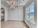 Dining room with hardwood floors, chandelier, and large window at 308 Happy Valley Dr., Myrtle Beach, SC 29588