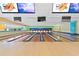 Modern bowling alley with multiple lanes and large screen TVs at 1105 S Ocean Blvd. # 1204, Myrtle Beach, SC 29572