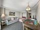 Studio unit with sofa bed, dining table, and adjacent kitchenette at 1105 S Ocean Blvd. # 1204, Myrtle Beach, SC 29572