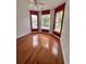 Spacious bedroom with hardwood floors, large windows, and red accent walls at 3609 White Oleander Ct., North Myrtle Beach, SC 29582