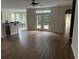 Spacious living room with hardwood floors and access to a backyard at 3609 White Oleander Ct., North Myrtle Beach, SC 29582