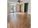 Living room featuring hardwood floors, a ceiling fan, and access to the backyard at 3609 White Oleander Ct., North Myrtle Beach, SC 29582