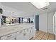 White kitchen with breakfast bar, marble countertops, and ocean view at 5511 N Ocean Blvd. # 306, Myrtle Beach, SC 29577