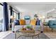 Living room with a gray sofa and a gold coffee table at 5511 N Ocean Blvd. # 306, Myrtle Beach, SC 29577