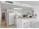 White kitchen with breakfast bar and stainless steel appliances at 5511 N Ocean Blvd. # 306, Myrtle Beach, SC 29577