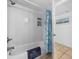 Clean bathroom with shower/tub combo, tile flooring, and beachy decor at 5511 N Ocean Blvd. # 306, Myrtle Beach, SC 29577