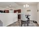 Cozy dining area with a round table and two chairs adjacent to kitchen at 2009 Spring Valley Ct., Loris, SC 29569