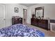Bedroom with dresser, mirror and floral bedding at 2009 Spring Valley Ct., Loris, SC 29569