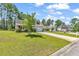 Houses with yards and driveways in a residential neighborhood at 2009 Spring Valley Ct., Loris, SC 29569