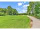 Landscaped golf course with a paved pathway nearby at 2009 Spring Valley Ct., Loris, SC 29569