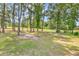 Backyard with lush trees and open space at 2009 Spring Valley Ct., Loris, SC 29569