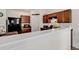 Modern kitchen with dark wood cabinets and black appliances at 2009 Spring Valley Ct., Loris, SC 29569