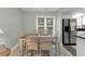 Bright dining area with table and chairs, adjacent to kitchen at 4314 S Ocean Blvd. # B-1, North Myrtle Beach, SC 29582