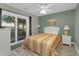 Bedroom with a queen-size bed and access to a balcony at 4314 S Ocean Blvd. # B-1, North Myrtle Beach, SC 29582