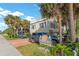Two-story beach house with parking and palm trees at 4314 S Ocean Blvd. # B-1, North Myrtle Beach, SC 29582
