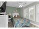 Guest bedroom with a double bed, ceiling fan, and window blinds at 4314 S Ocean Blvd. # B-1, North Myrtle Beach, SC 29582