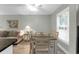 Dining area with table and chairs near a living room and kitchen at 4314 S Ocean Blvd. # B-1, North Myrtle Beach, SC 29582