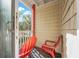 Private balcony with two red chairs and partial ocean view at 4314 S Ocean Blvd. # B-1, North Myrtle Beach, SC 29582