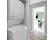 White stackable washer and dryer in hallway closet at 4314 S Ocean Blvd. # B-1, North Myrtle Beach, SC 29582