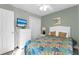 Bright bedroom with a floral comforter and white dresser at 4314 S Ocean Blvd. # B-1, North Myrtle Beach, SC 29582