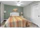 Light and airy bedroom with a queen bed and ceiling fan at 4314 S Ocean Blvd. # B-1, North Myrtle Beach, SC 29582
