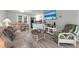 Open living room with sofa, dining area, and kitchen at 4314 S Ocean Blvd. # B-1, North Myrtle Beach, SC 29582