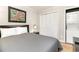 Bedroom with double bed, closet, and stackable washer/dryer at 4303 S Ocean Blvd. # 107, North Myrtle Beach, SC 29582