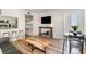 Bright living room featuring a comfy couch, a coffee table and a bunk bed at 4303 S Ocean Blvd. # 107, North Myrtle Beach, SC 29582