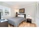 Comfortable bedroom with a double bed, nightstand, and closet at 4303 S Ocean Blvd. # 107, North Myrtle Beach, SC 29582